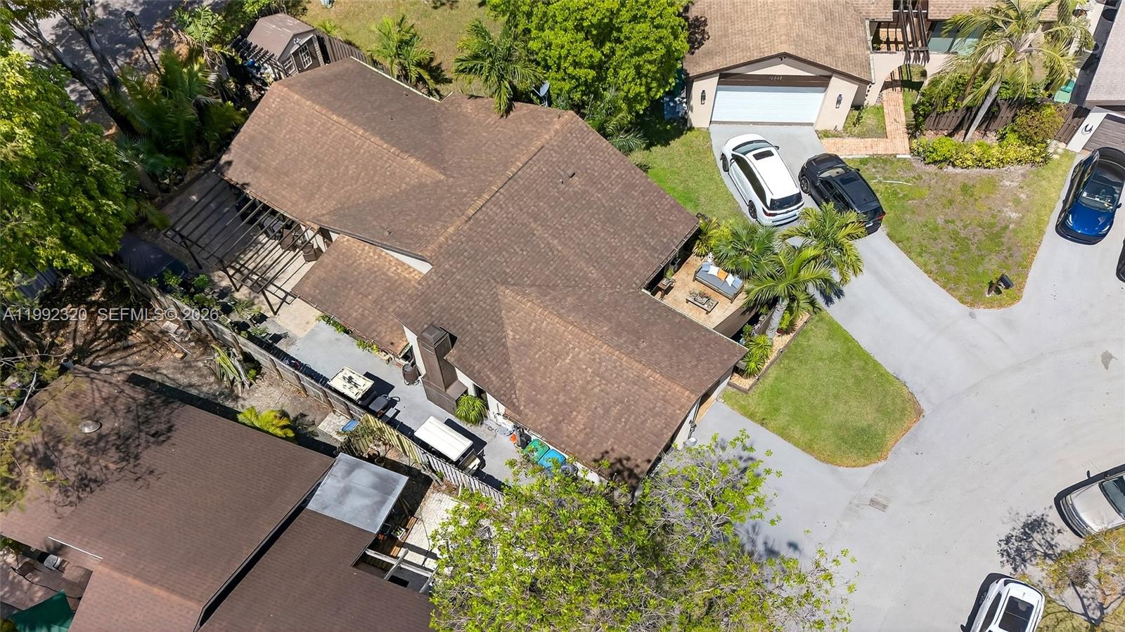10861 Southwest 132nd Cir Court Miami, FL 33186 - Photo 4 of 42 an aerial view of a house with outdoor space and a lake view