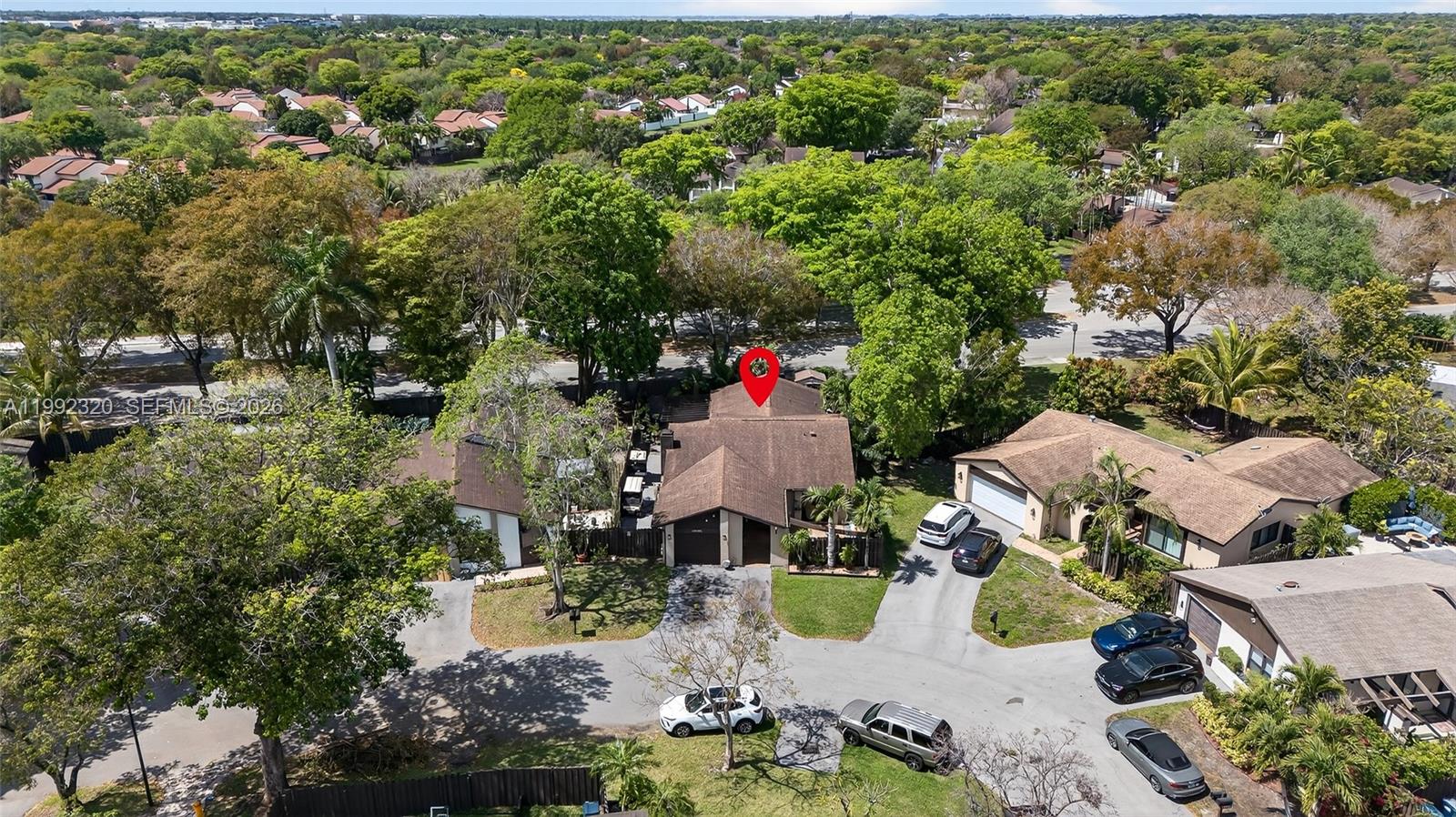 10861 Southwest 132nd Cir Court Miami, FL 33186 - Photo 6 of 42 an aerial view of a house with a yard and lake view