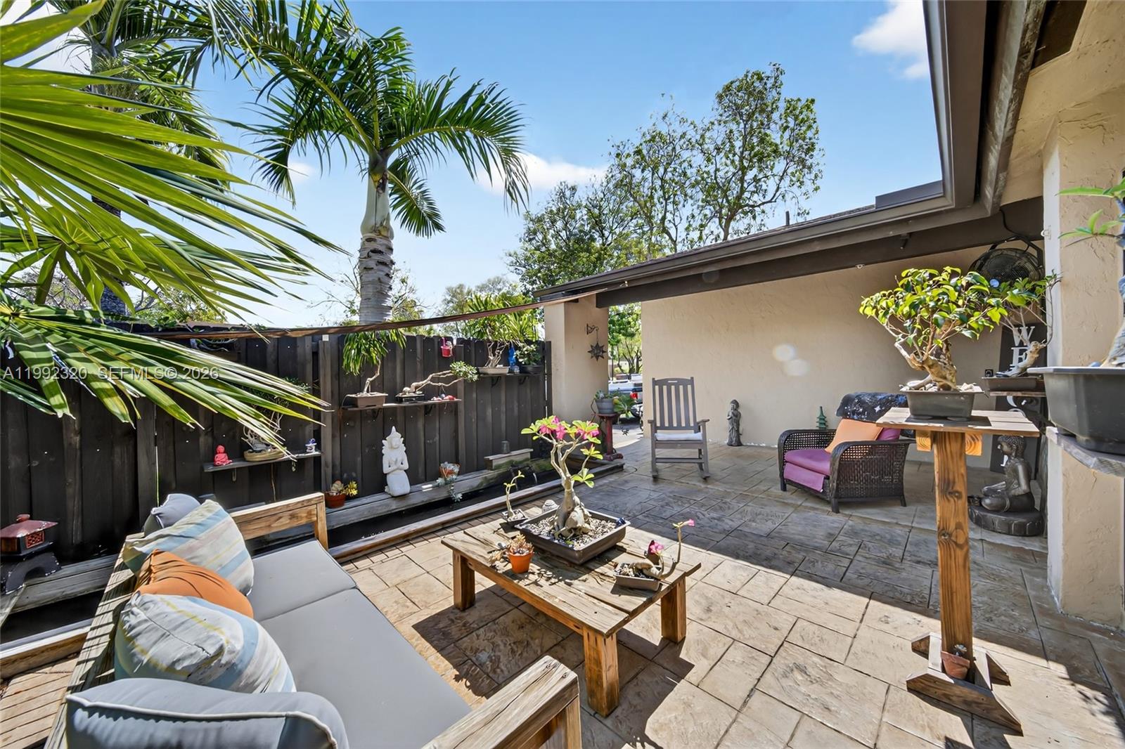 10861 Southwest 132nd Cir Court Miami, FL 33186 - Photo 9 of 42 a backyard of a house with seating space