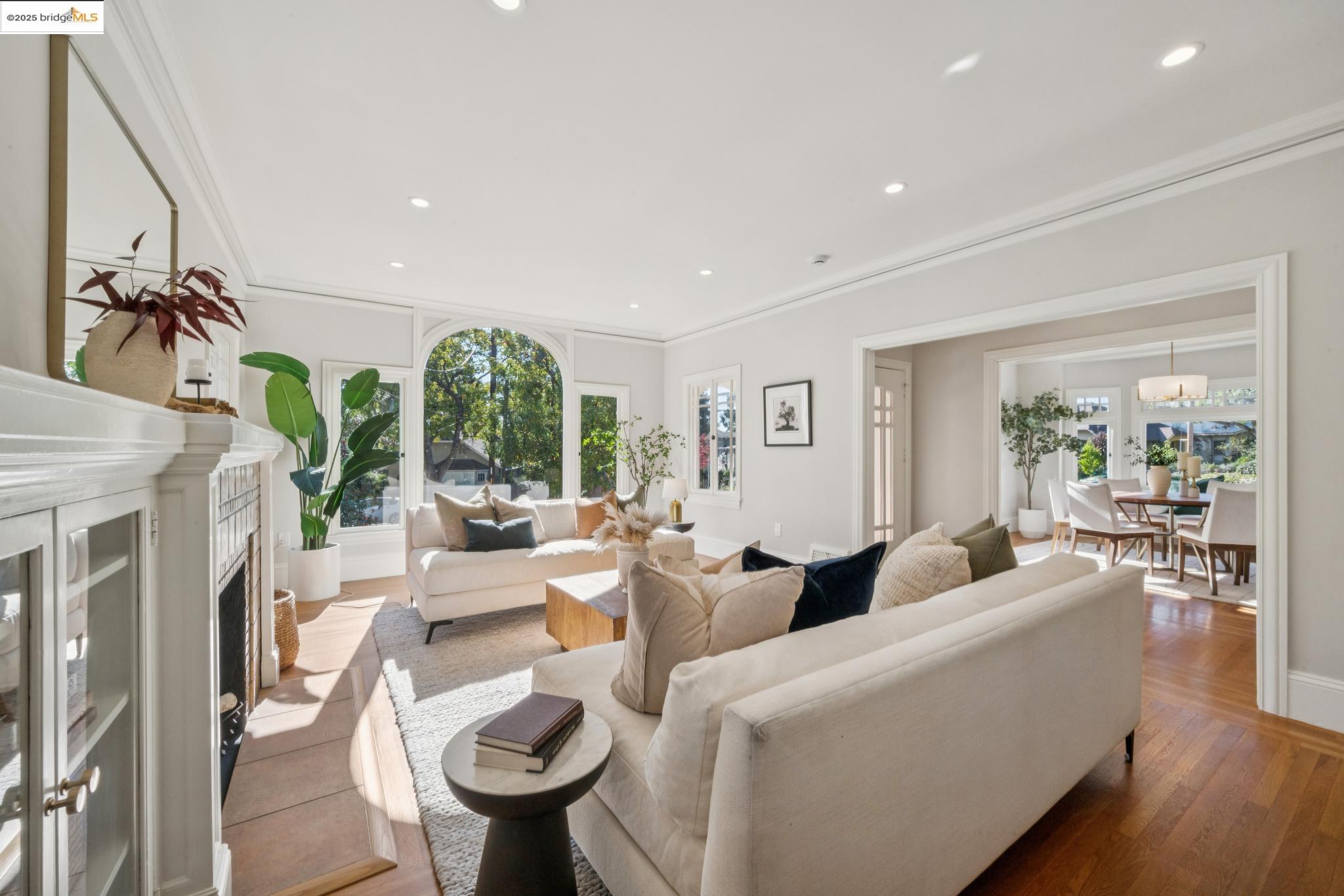 1833 Sonoma Avenue Berkeley, CA 94707 - Photo 12 of 57 a living room with furniture a fireplace and a floor to ceiling window