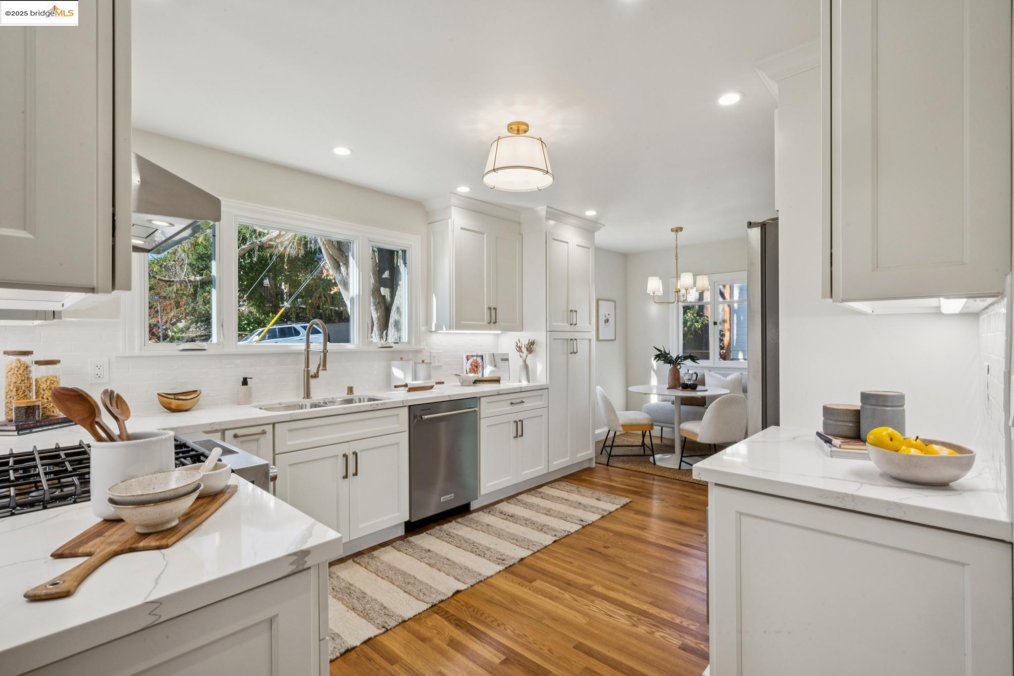 1833 Sonoma Avenue Berkeley, CA 94707 - Photo 17 of 57 a kitchen with a sink stove and cabinets