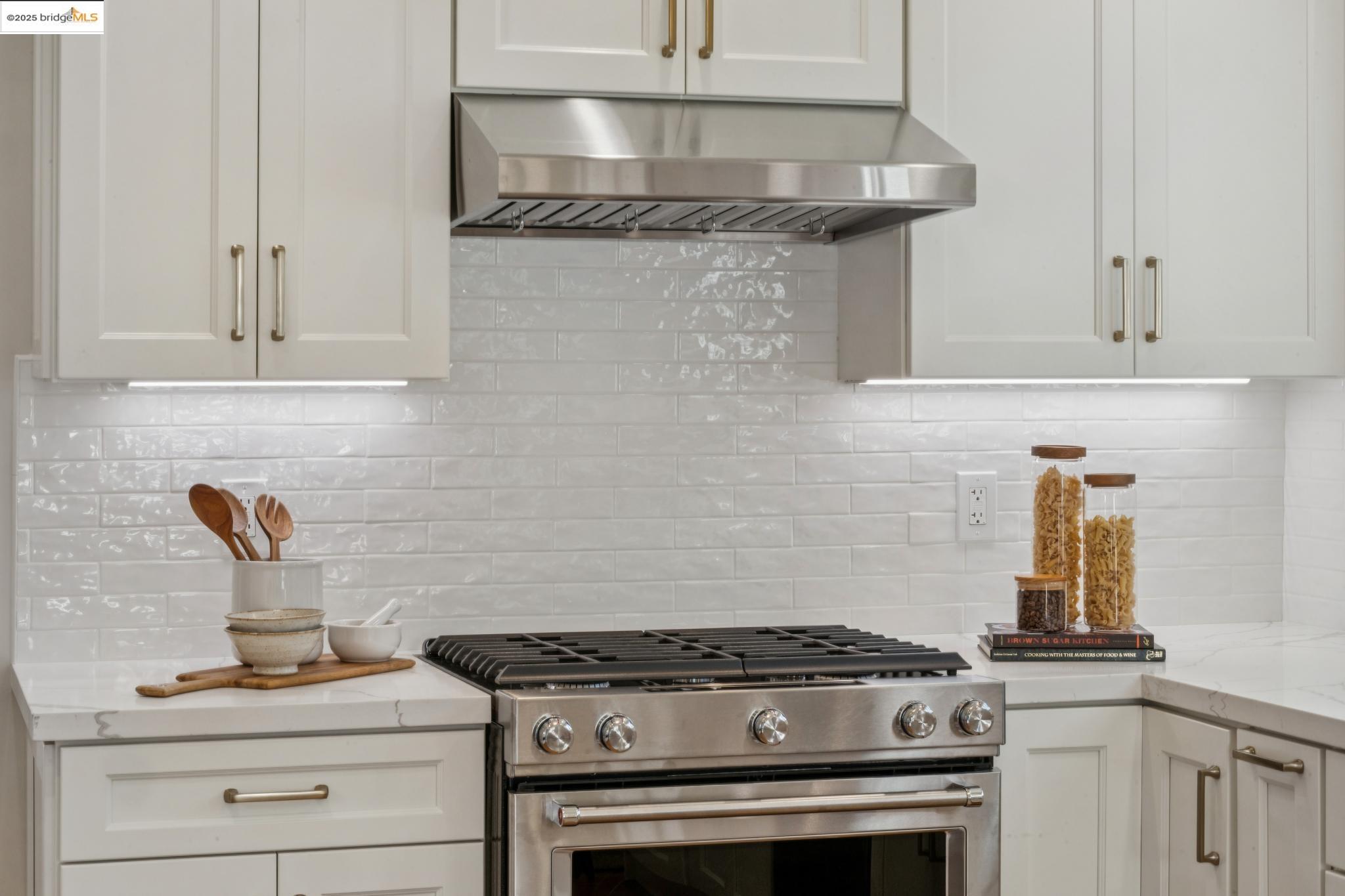 1833 Sonoma Avenue Berkeley, CA 94707 - Photo 19 of 57 a stove top oven sitting inside of a kitchen
