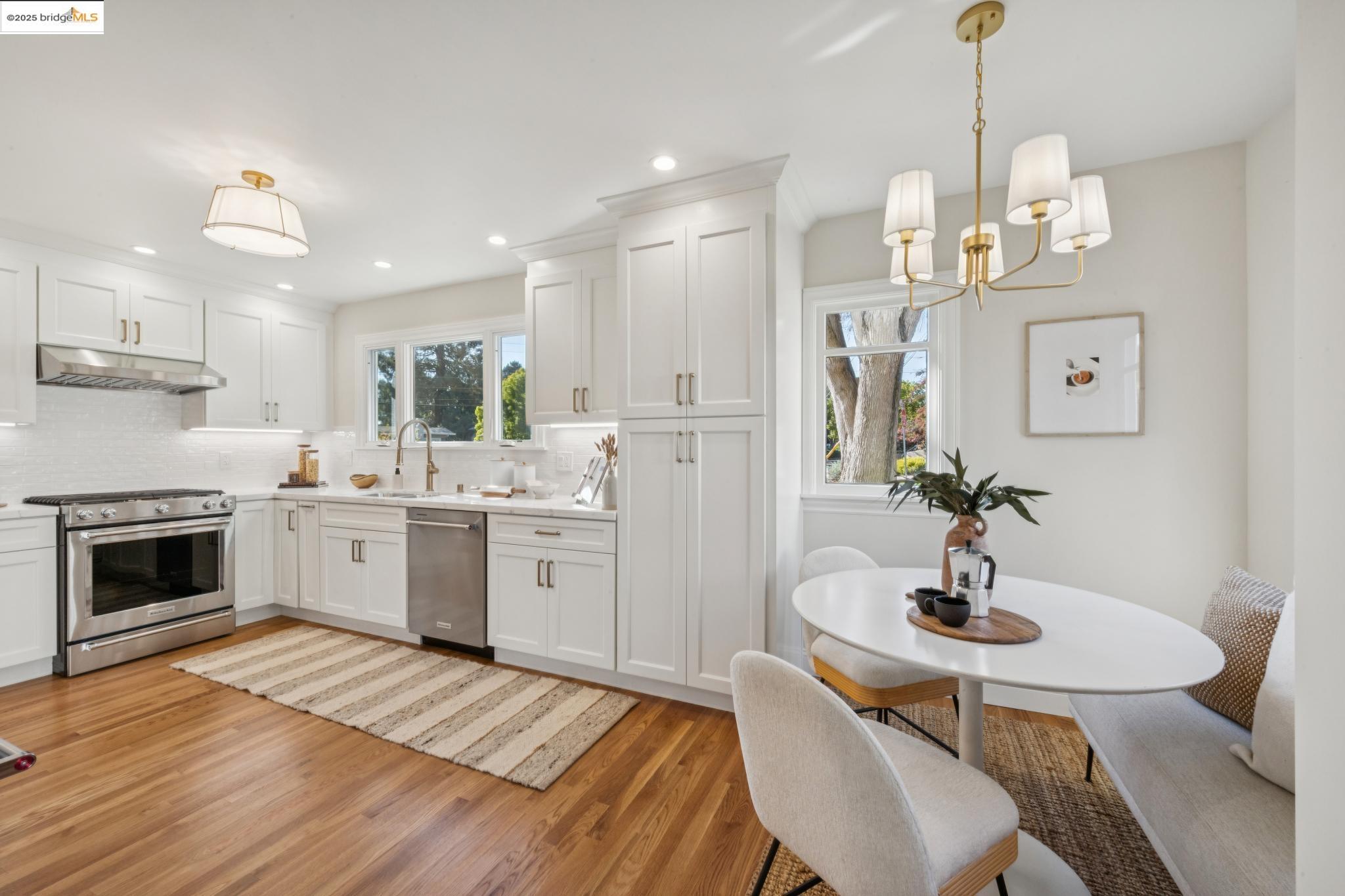 1833 Sonoma Avenue Berkeley, CA 94707 - Photo 20 of 57 a kitchen that has a sink stainless steel appliances and white cabinets