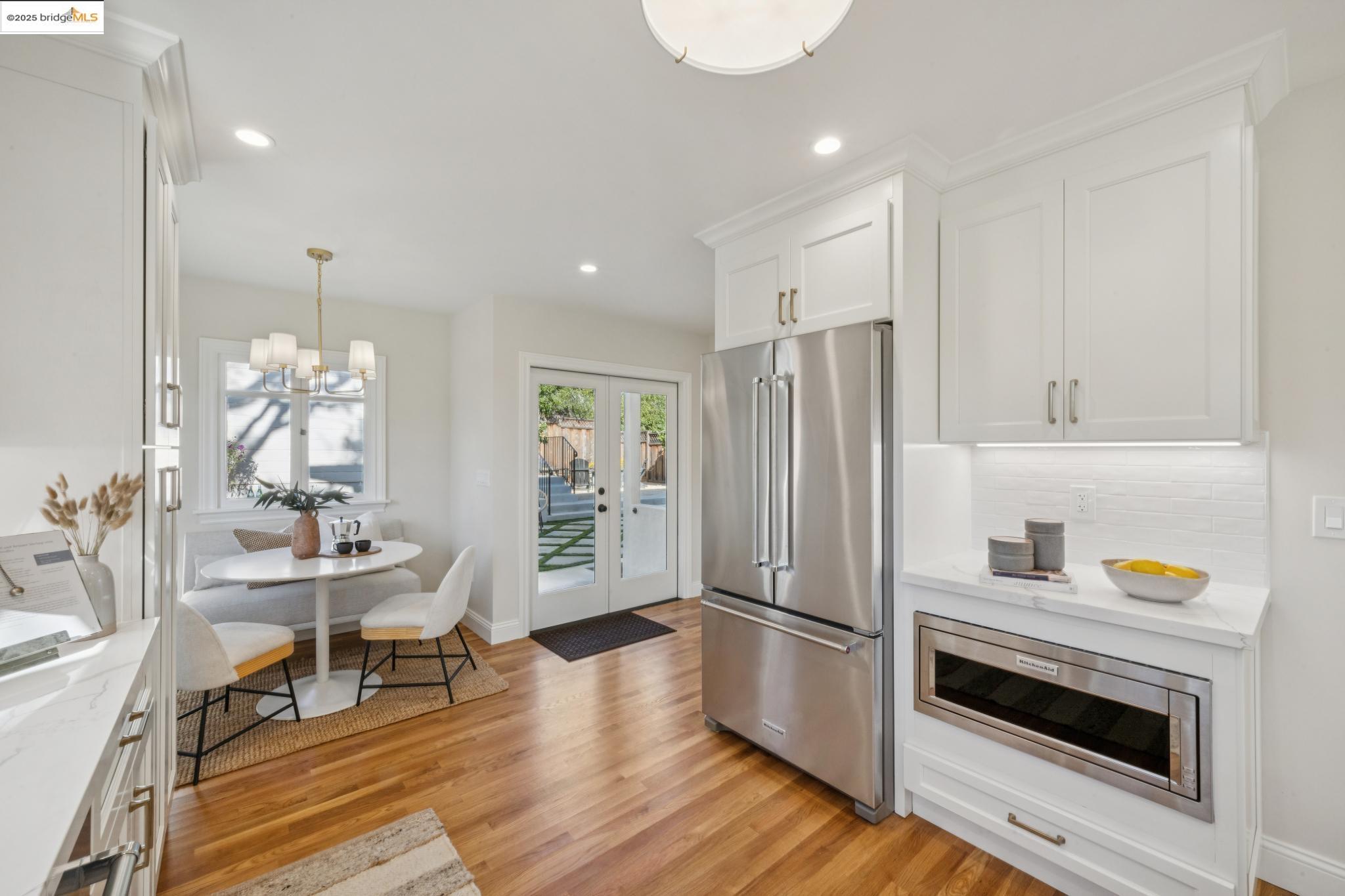 1833 Sonoma Avenue Berkeley, CA 94707 - Photo 22 of 57 a kitchen with stainless steel appliances a refrigerator and a stove top oven