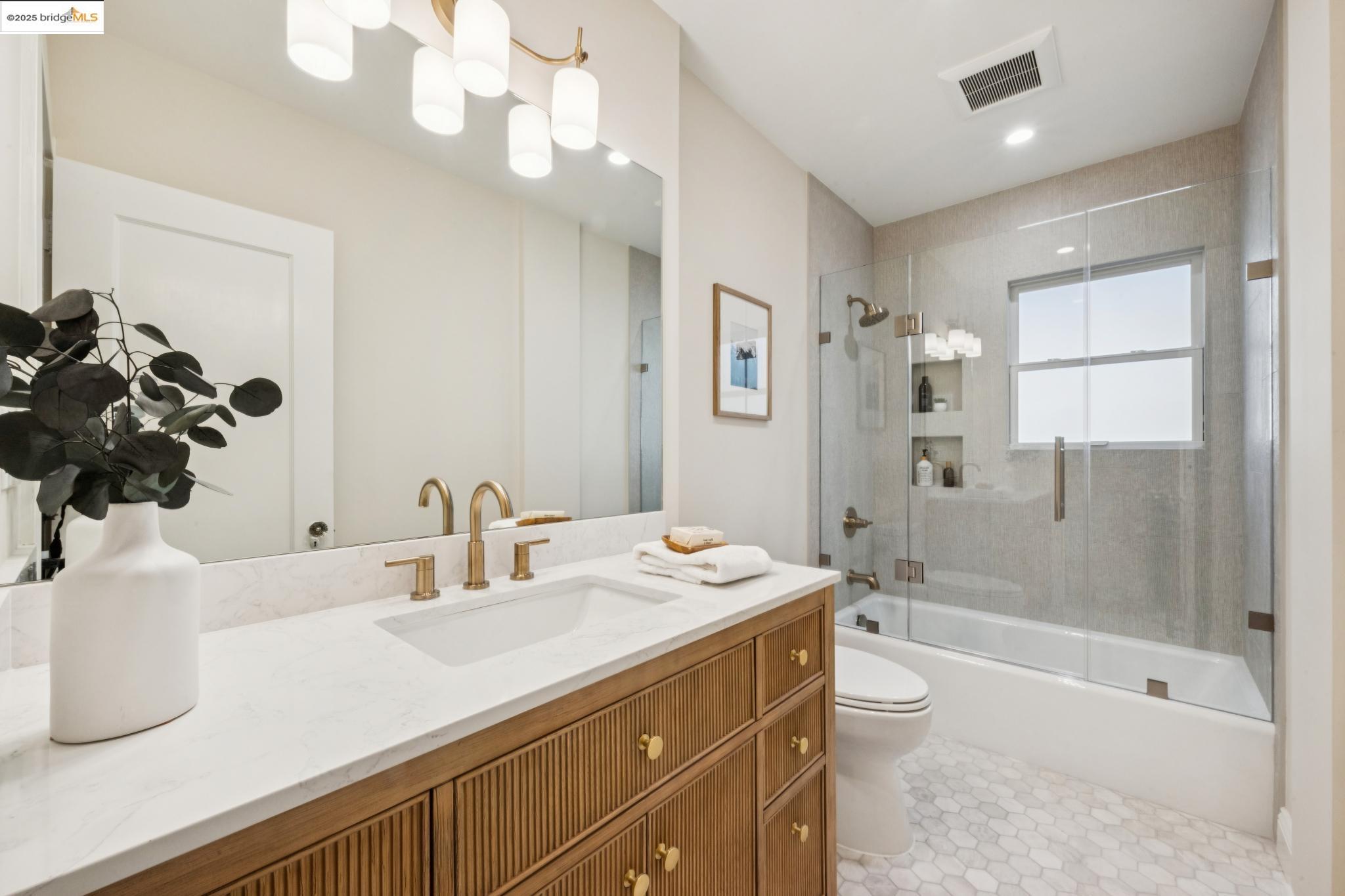 1833 Sonoma Avenue Berkeley, CA 94707 - Photo 27 of 57 a bathroom with a tub sink and mirror