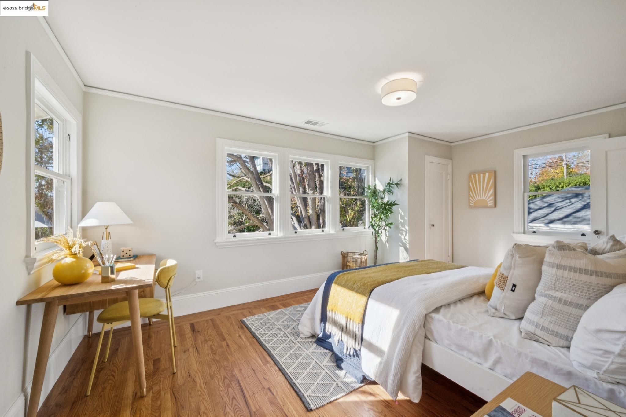 1833 Sonoma Avenue Berkeley, CA 94707 - Photo 29 of 57 a bedroom with a bed and wooden floor