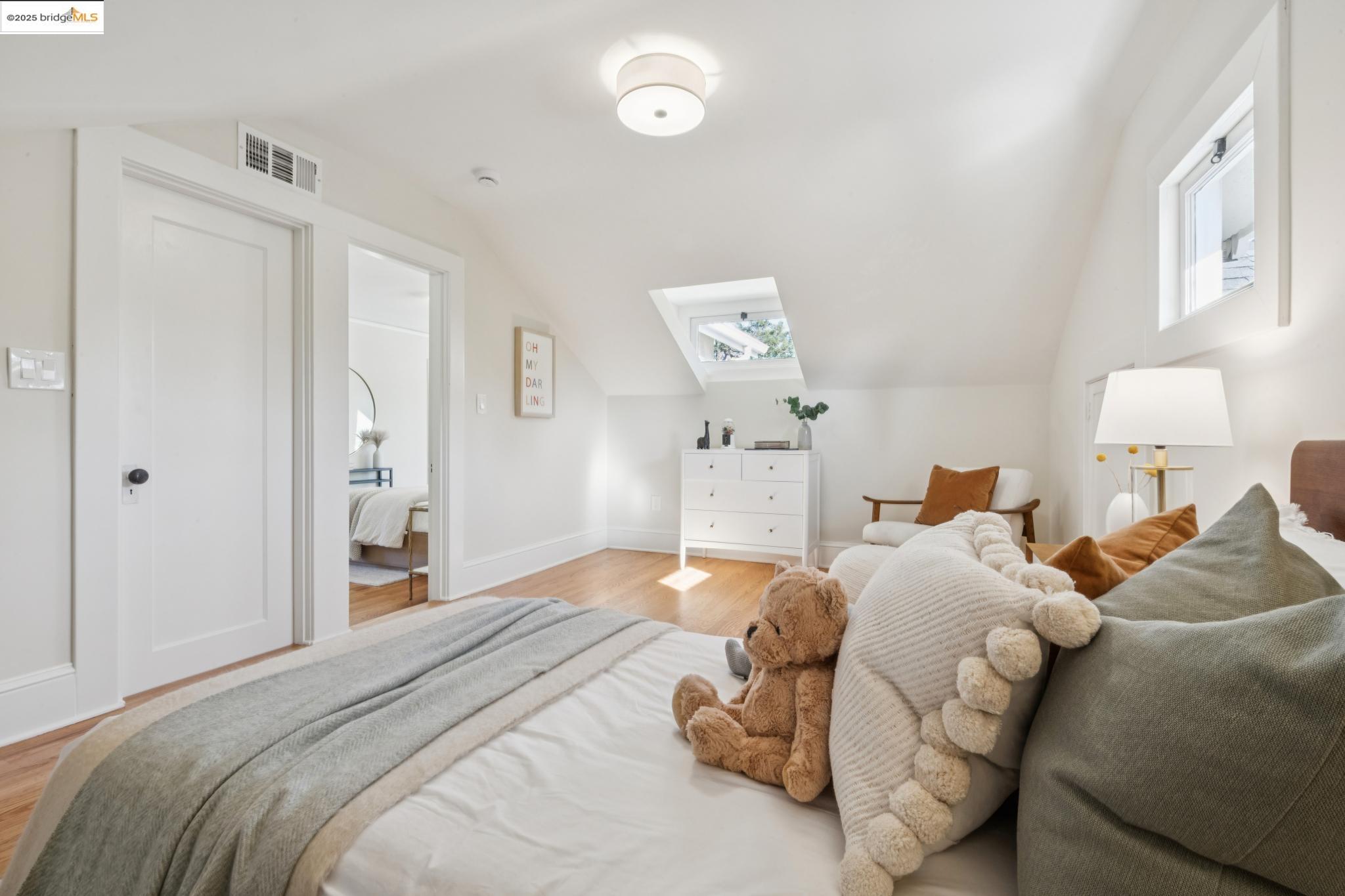 1833 Sonoma Avenue Berkeley, CA 94707 - Photo 31 of 57 a bedroom with a bed and a lamp