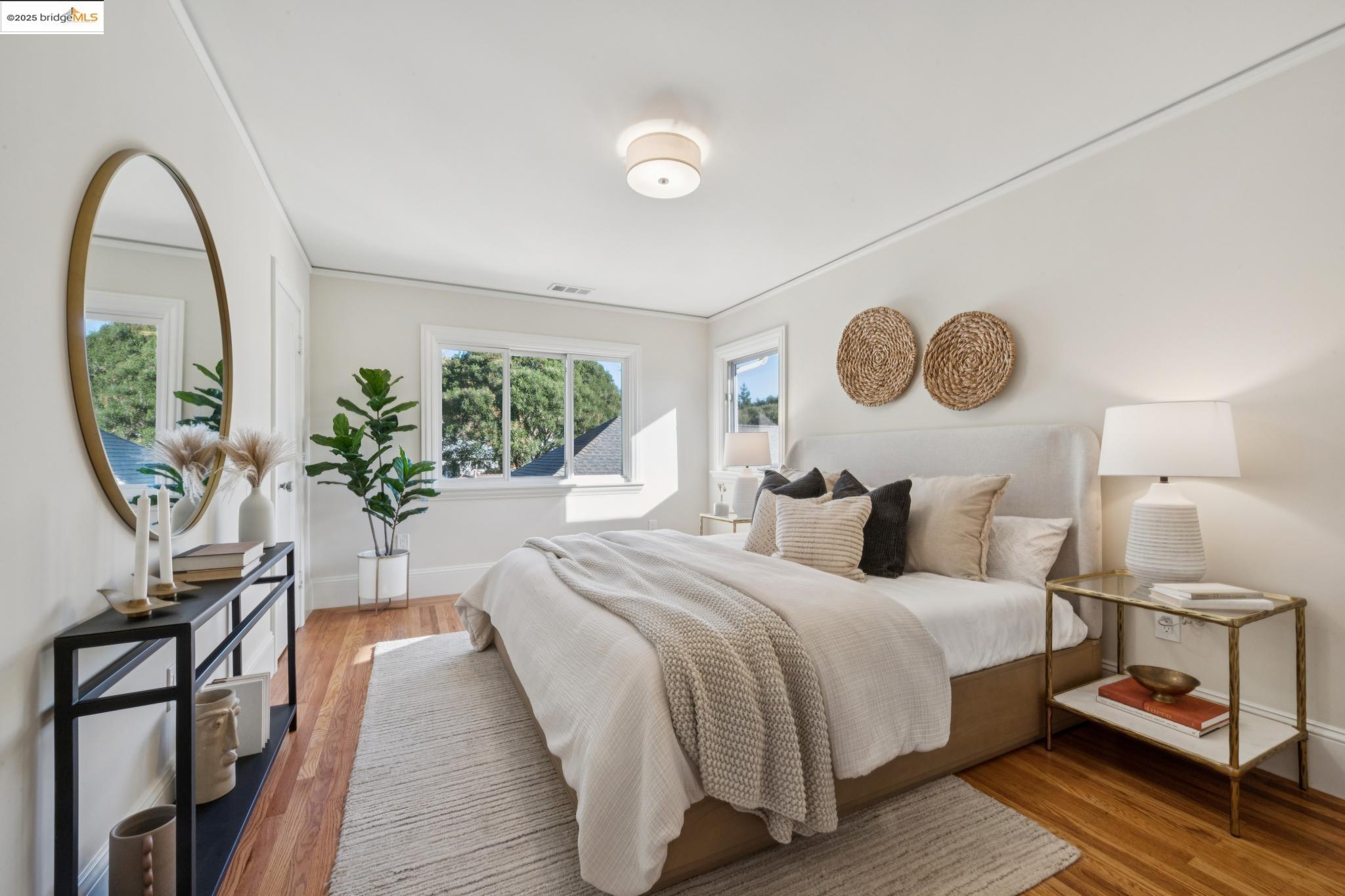 1833 Sonoma Avenue Berkeley, CA 94707 - Photo 33 of 57 a bedroom with a bed and a lamp on dresser with wooden floor