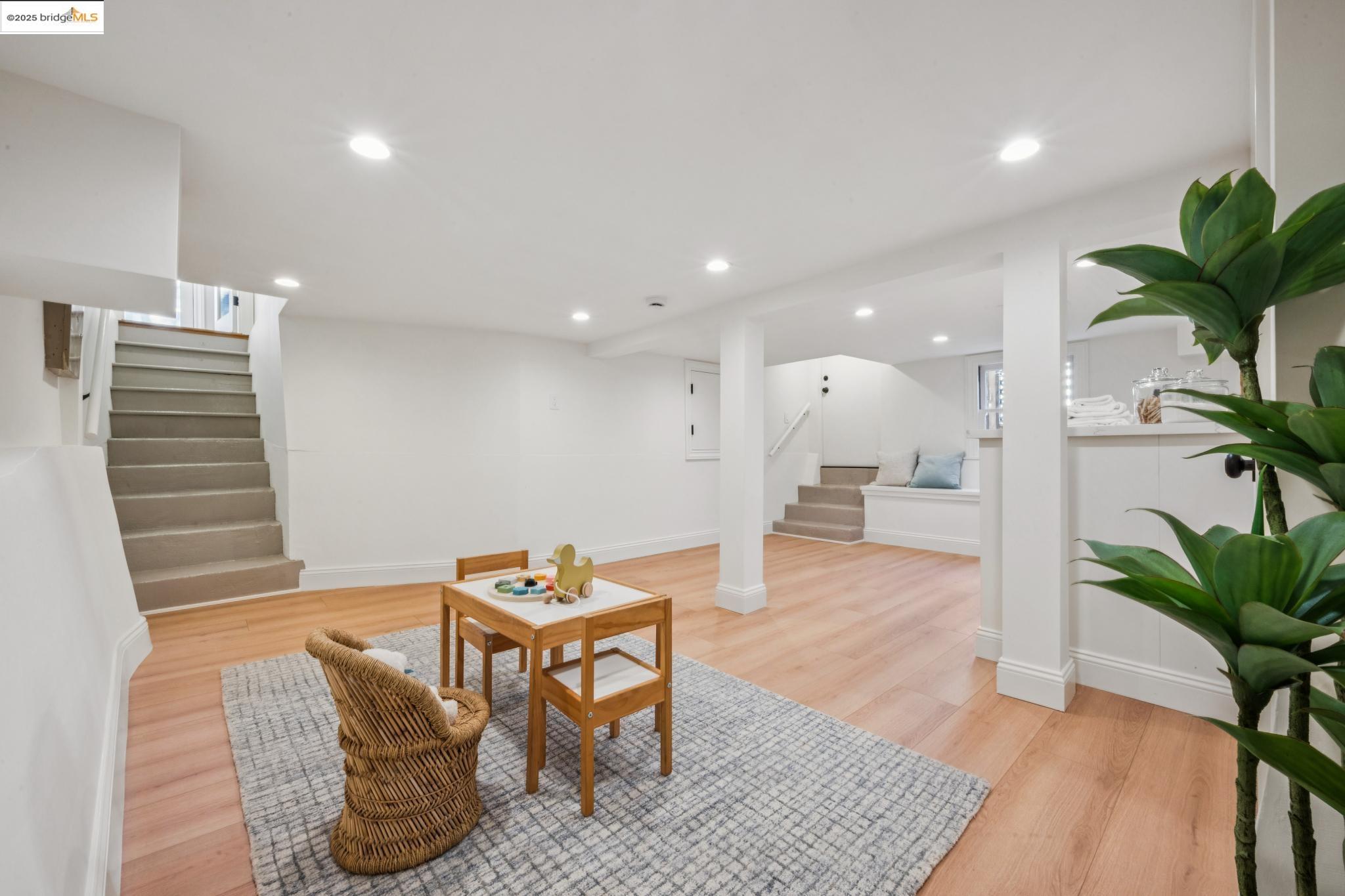 1833 Sonoma Avenue Berkeley, CA 94707 - Photo 35 of 57 a living room with furniture and a potted plant