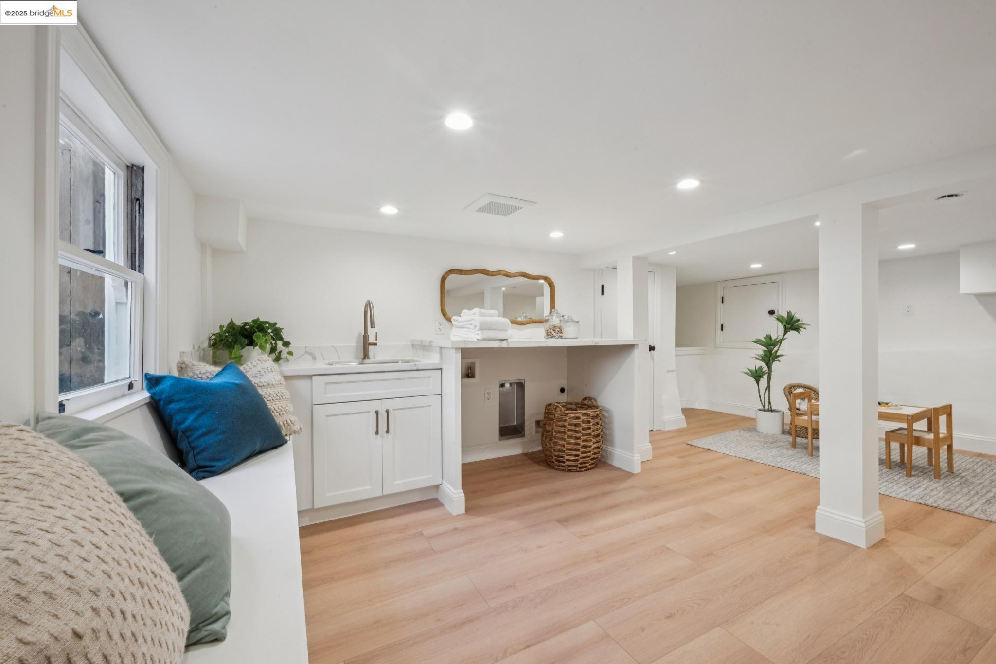 1833 Sonoma Avenue Berkeley, CA 94707 - Photo 37 of 57 a living room with furniture and a wooden floor