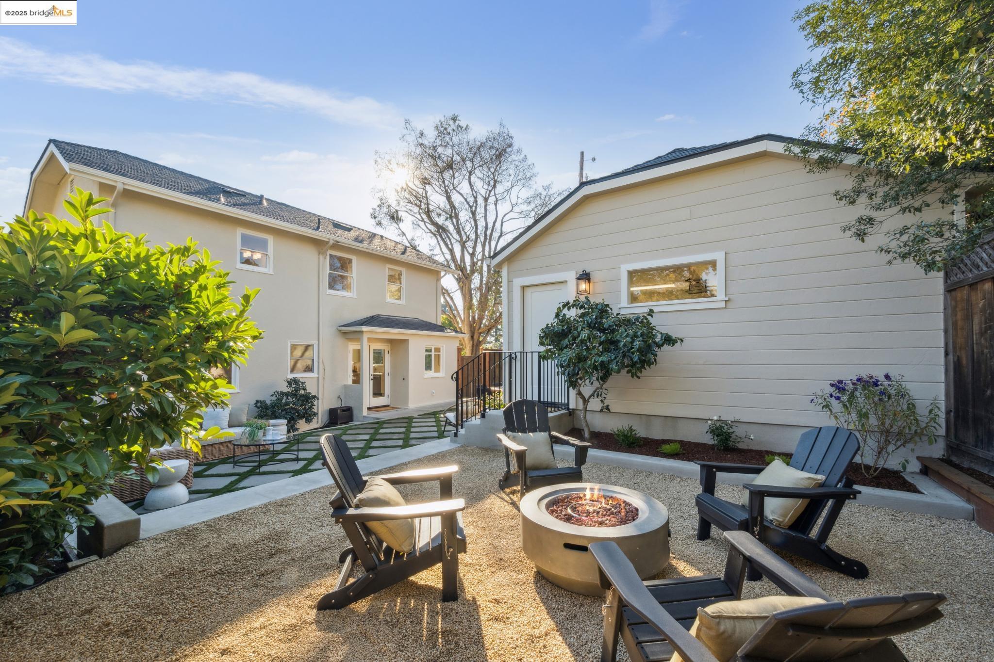 1833 Sonoma Avenue Berkeley, CA 94707 - Photo 42 of 57 a backyard of a house with fire pit and outdoor seating
