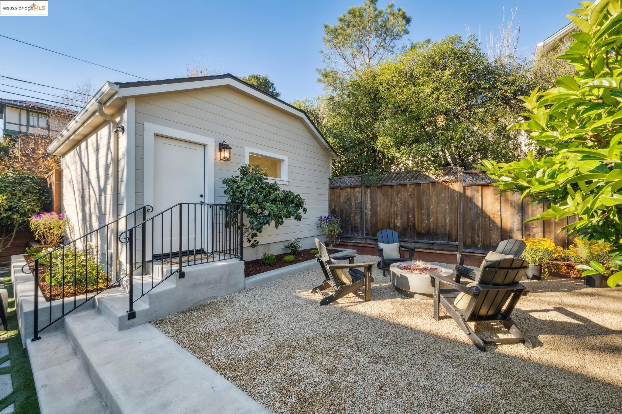 1833 Sonoma Avenue Berkeley, CA 94707 - Photo 43 of 57 a backyard of a house with table and chairs