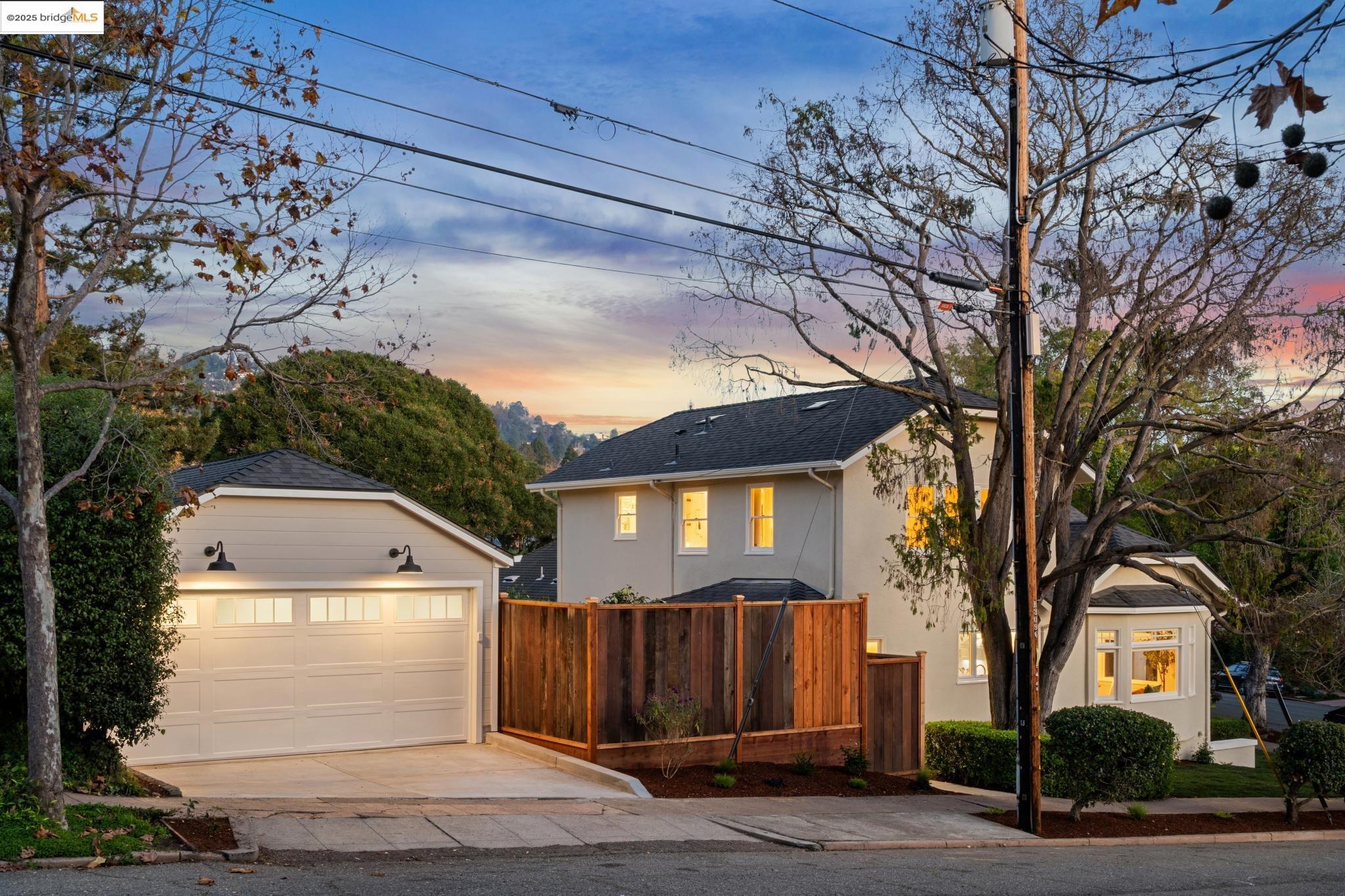 1833 Sonoma Avenue Berkeley, CA 94707 - Photo 48 of 57 a view of a white house with a large tree