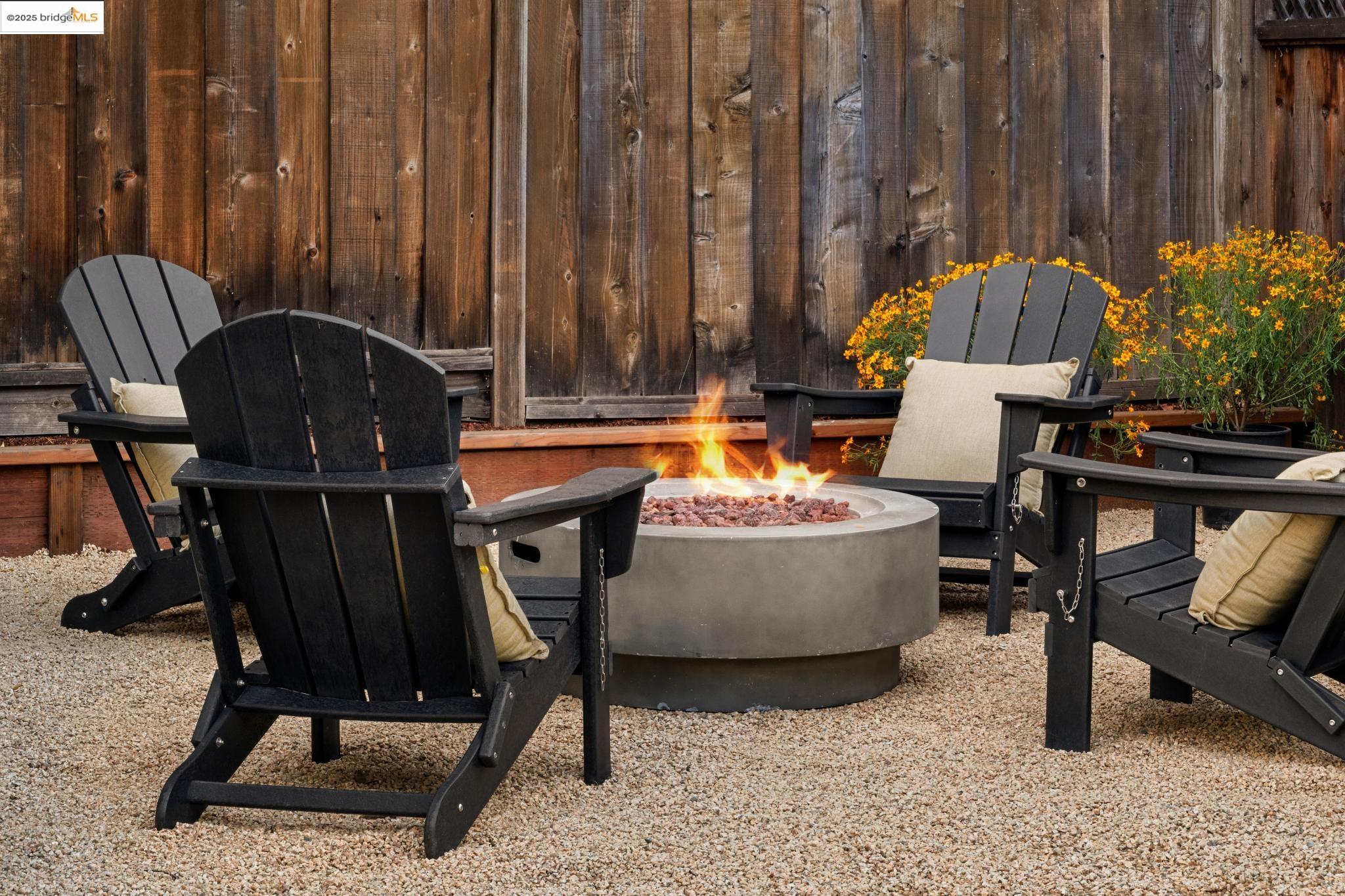1833 Sonoma Avenue Berkeley, CA 94707 - Photo 57 of 57 Outdoor living space with a fire pit. Virtual fire in fire pit.