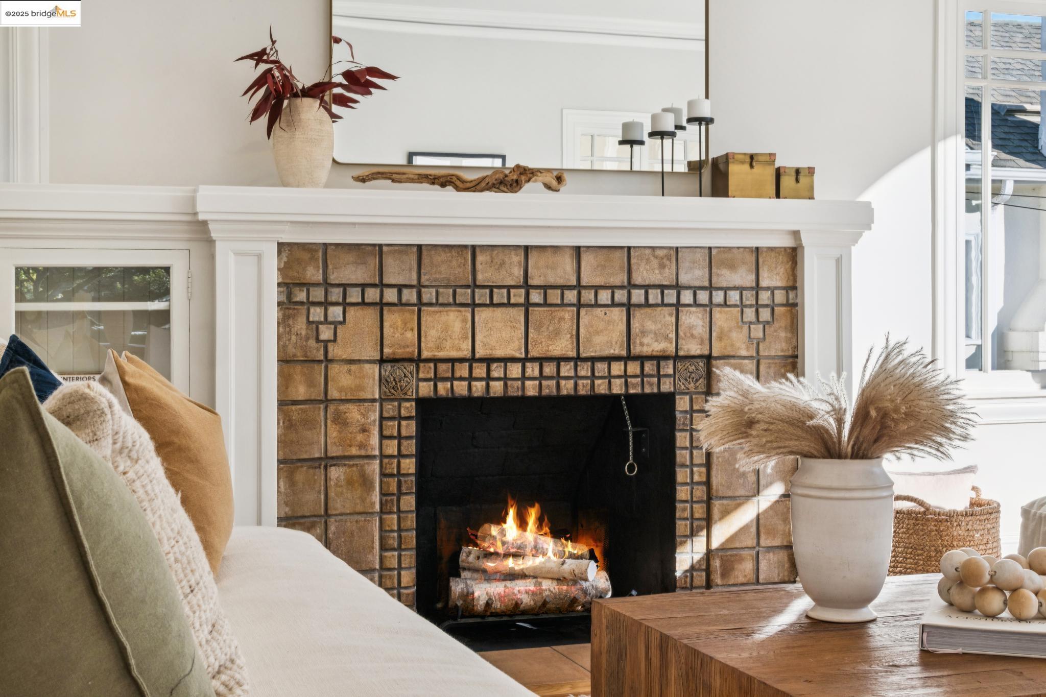1833 Sonoma Avenue Berkeley, CA 94707 - Photo 9 of 57 a living room with furniture a fireplace and a potted plant