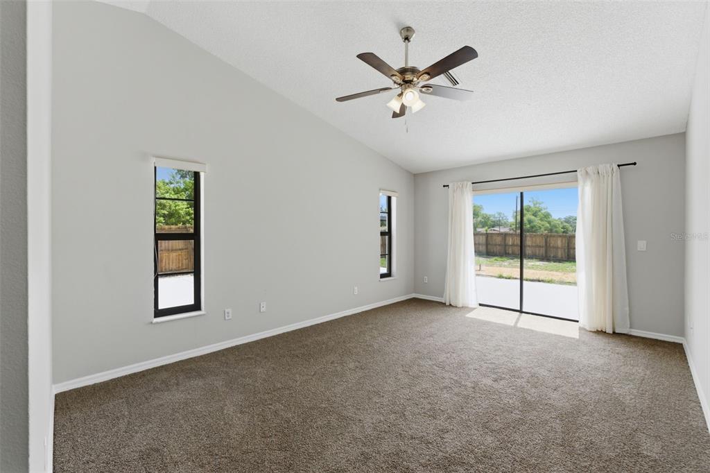 4966 Keysville Avenue Spring Hill, FL 34608 - Photo 26 of 48 an empty room with windows and closet