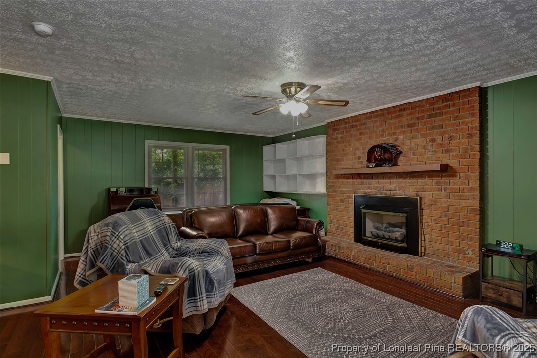994 East Great Marsh Church Road St. Pauls, NC 28384 - Photo 20 of 30 a living room with furniture and a fireplace