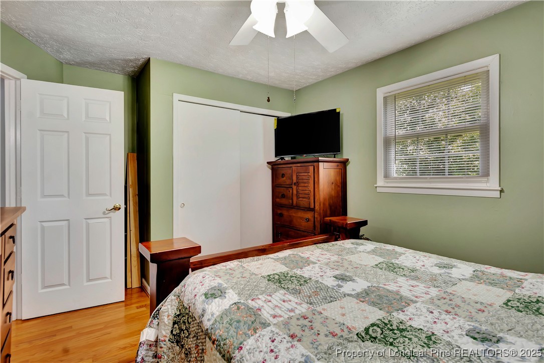 994 East Great Marsh Church Road St. Pauls, NC 28384 - Photo 27 of 30 a bedroom with a bed and a flat screen tv