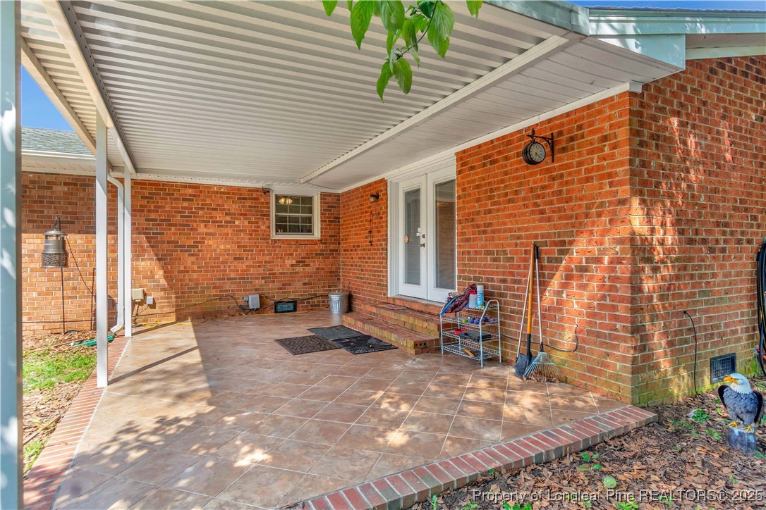 994 East Great Marsh Church Road St. Pauls, NC 28384 - Photo 4 of 30 a backyard of a house with outdoor seating