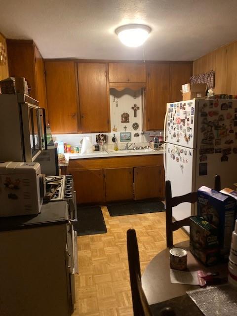7060 John T White Road Fort Worth, TX 76120 - Photo 4 of 13 a view of a kitchen with kitchen island dining table and chairs