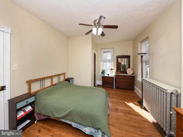 a kitchen with stainless steel appliances granite countertop a sink and a refrigerator