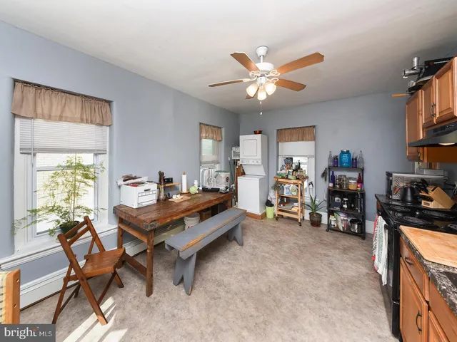 a living room with furniture and a mirror