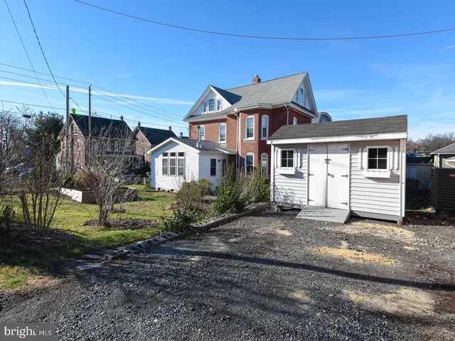 a front view of a house with yard