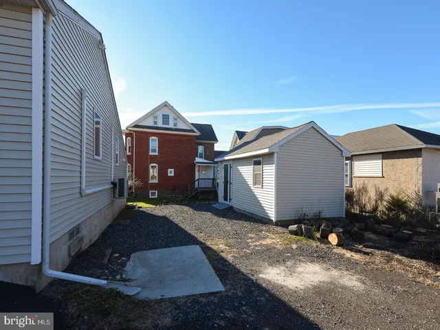 a living room with furniture a wooden floor and a flat screen tv