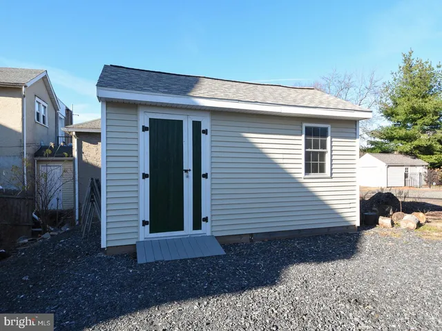 a bedroom with a bed and a view of bathroom
