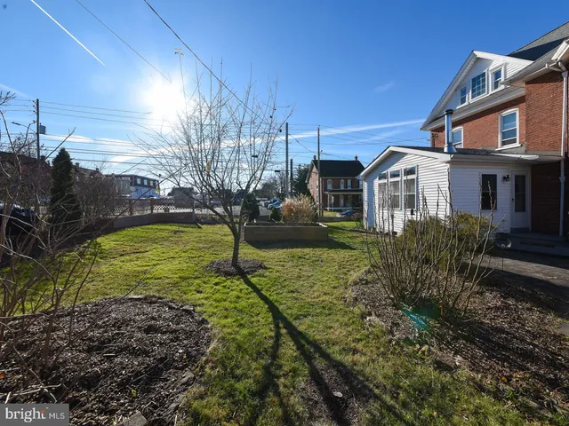 a bedroom with a bed and a desk