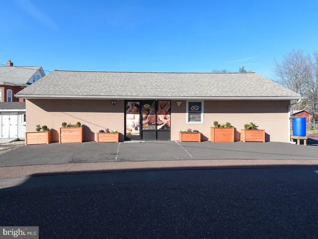 a view of a kitchen with wooden floor