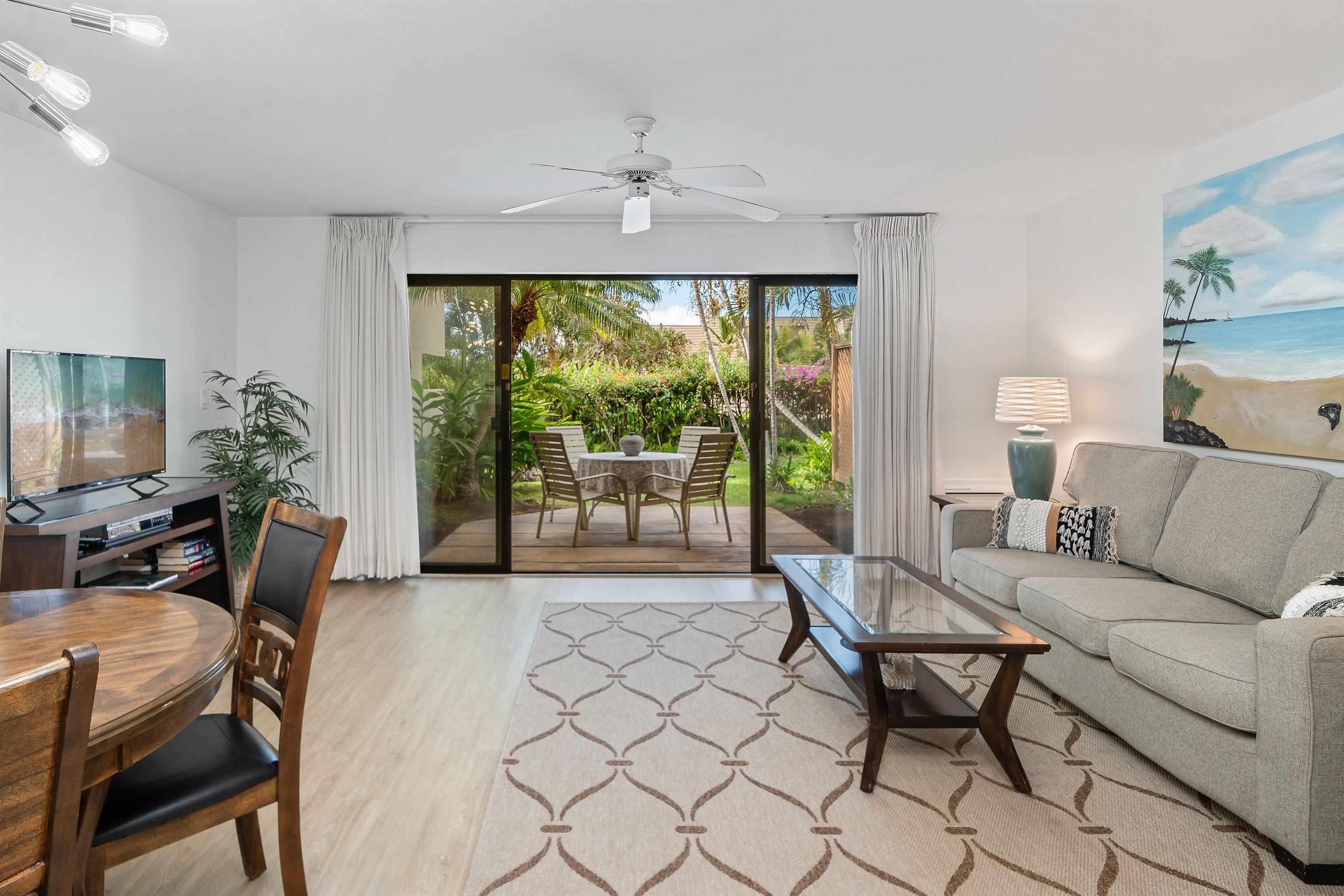 2777 South Kihei Road, Unit K102 Kihei, HI 96753 - Photo 18 of 41 a living room with furniture and a large window