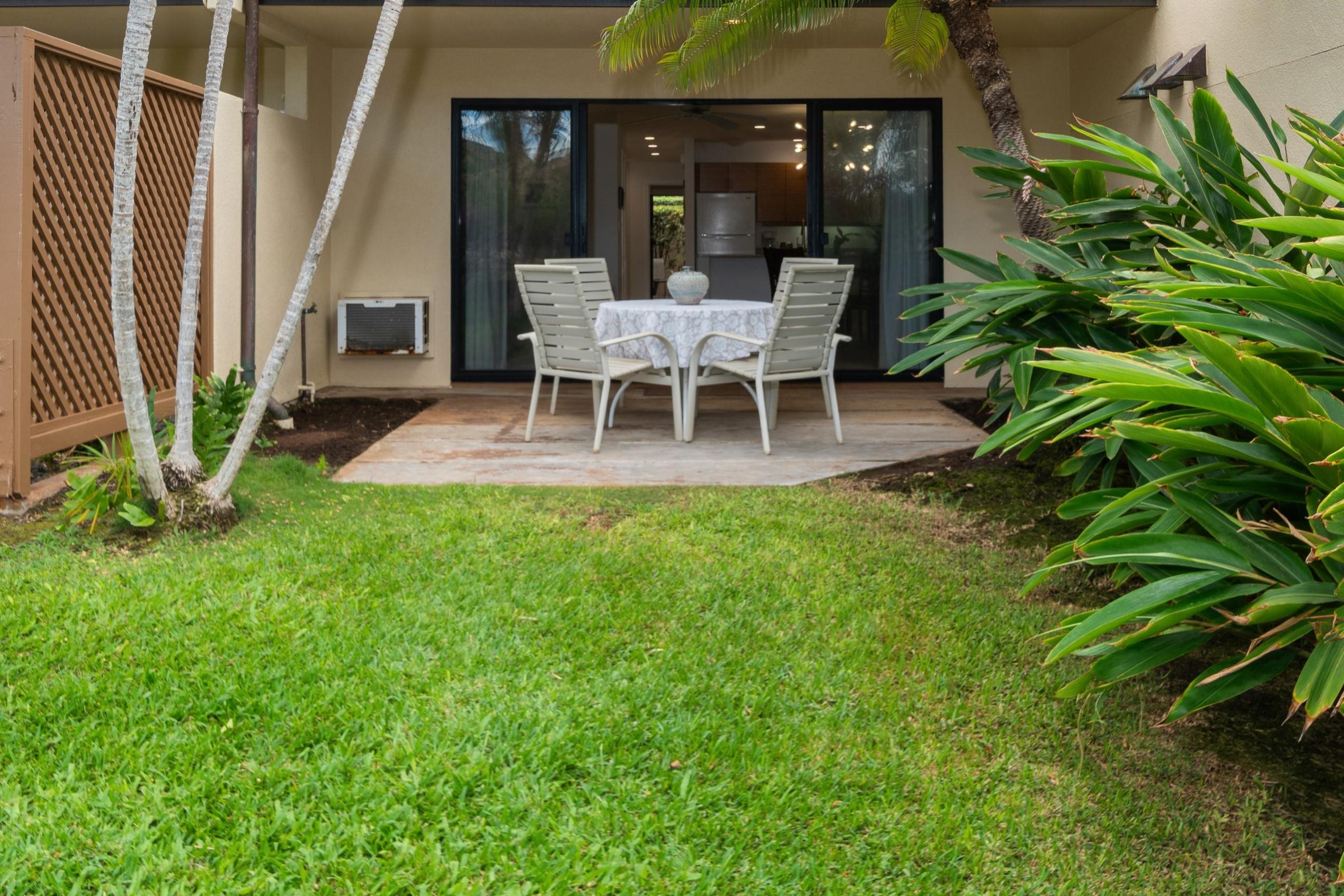 2777 South Kihei Road, Unit K102 Kihei, HI 96753 - Photo 21 of 41 a wooden bench sitting in front of a building