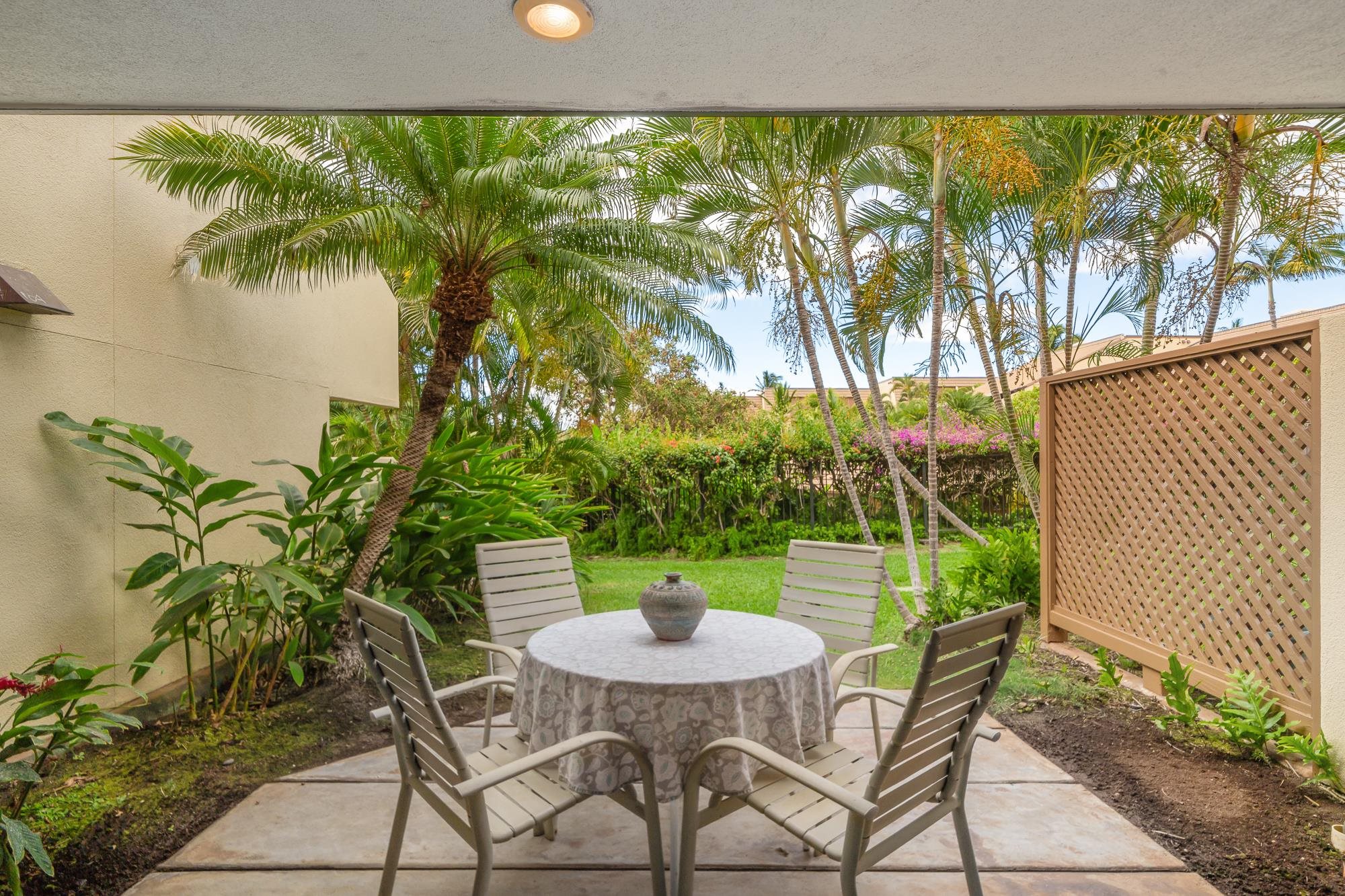 2777 South Kihei Road, Unit K102 Kihei, HI 96753 - Photo 3 of 47 a view of a backyard with plants and a patio