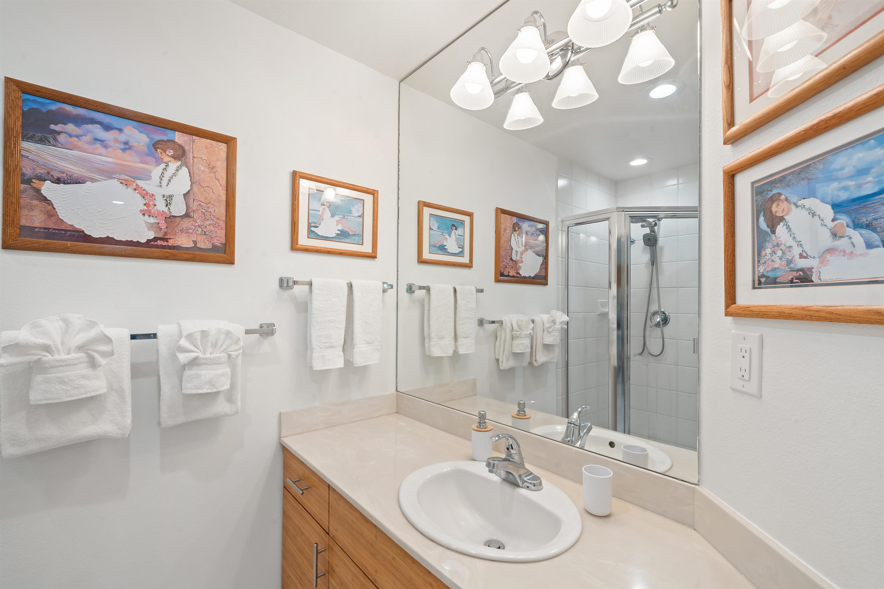 2777 South Kihei Road, Unit K102 Kihei, HI 96753 - Photo 33 of 41 a bathroom with a sink a mirror and a shower