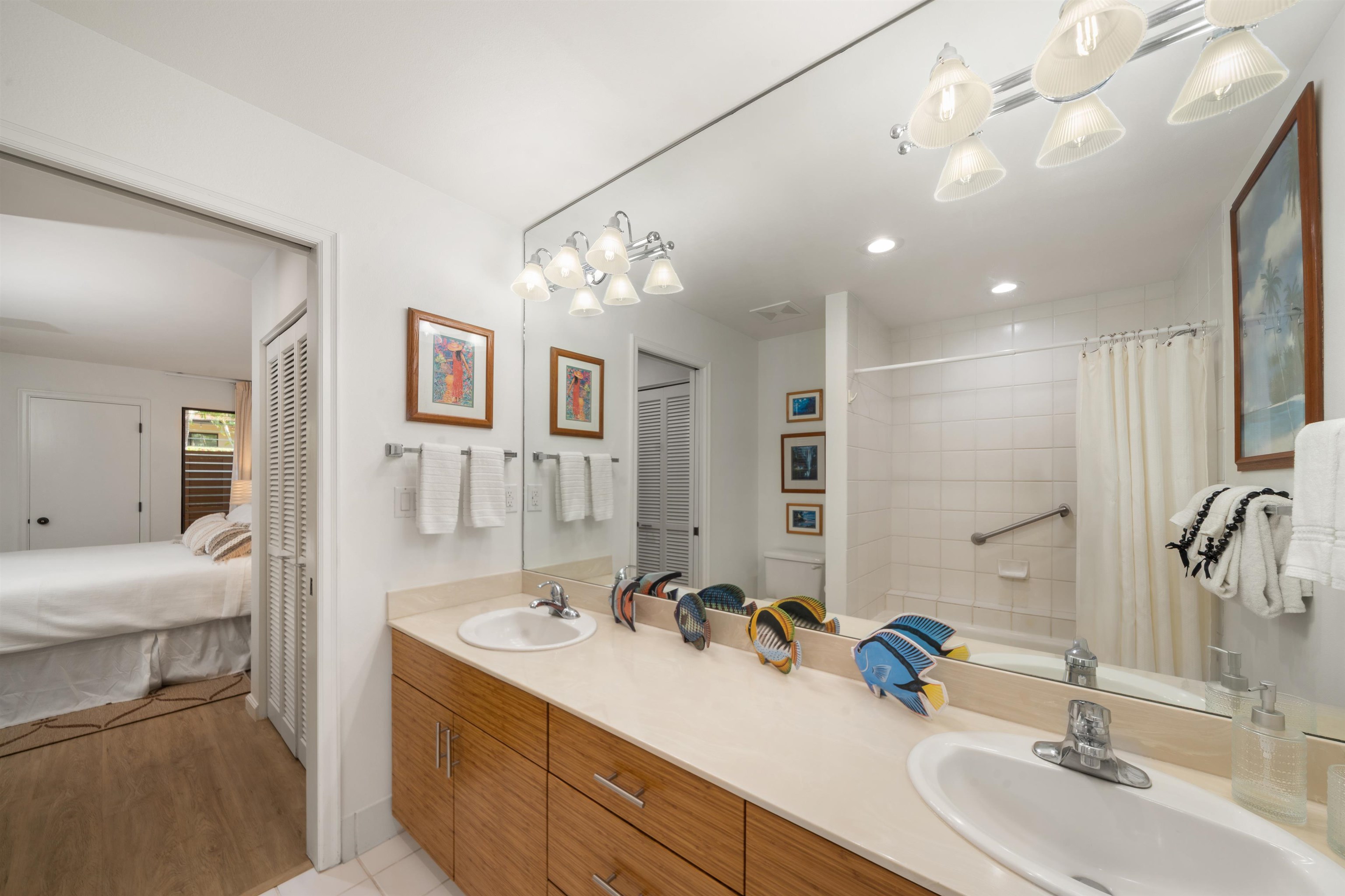 2777 South Kihei Road, Unit K102 Kihei, HI 96753 - Photo 36 of 47 a bathroom with a double vanity sink mirror and double