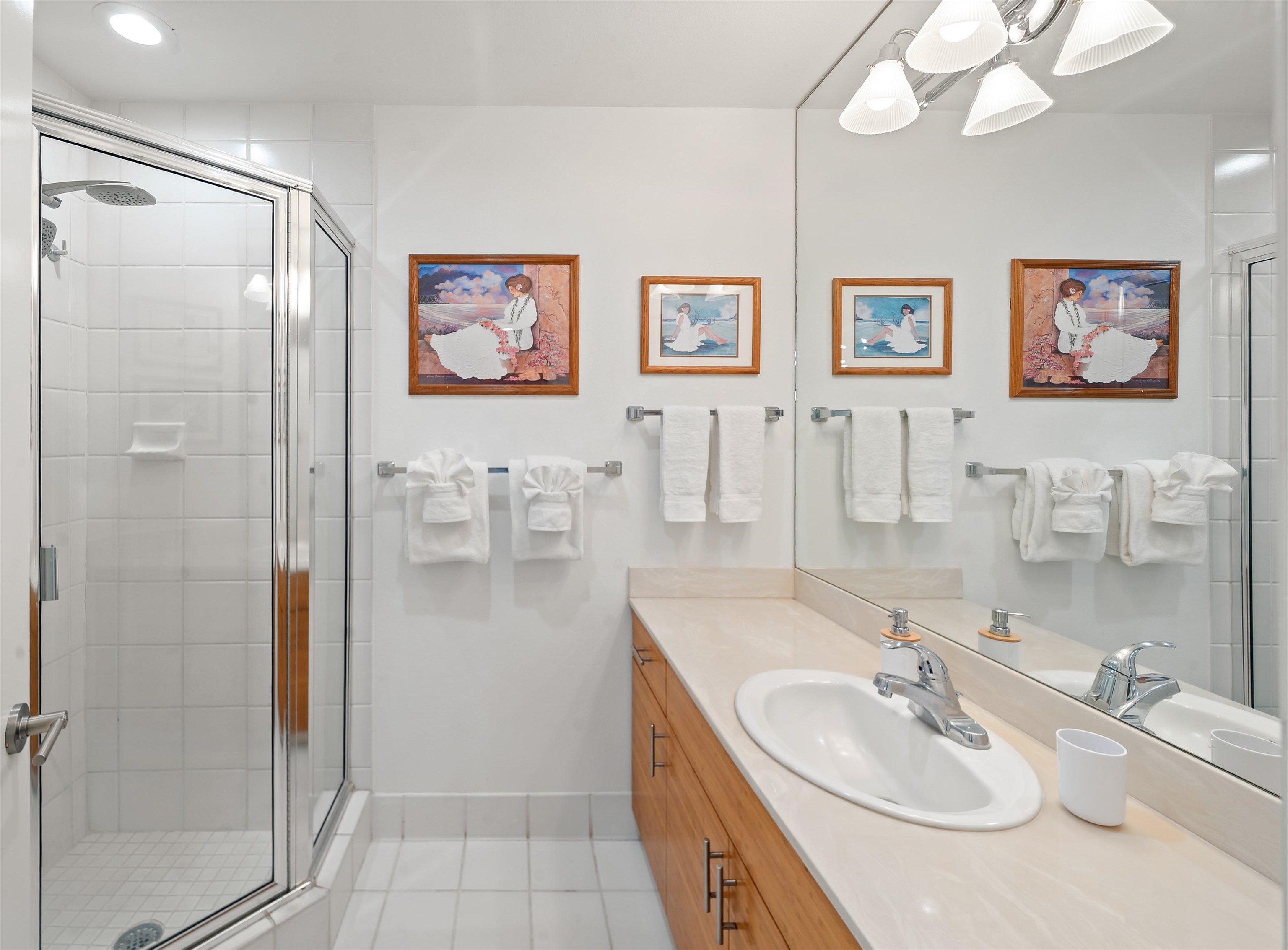2777 South Kihei Road, Unit K102 Kihei, HI 96753 - Photo 40 of 47 a bathroom with a sink mirror and a shower