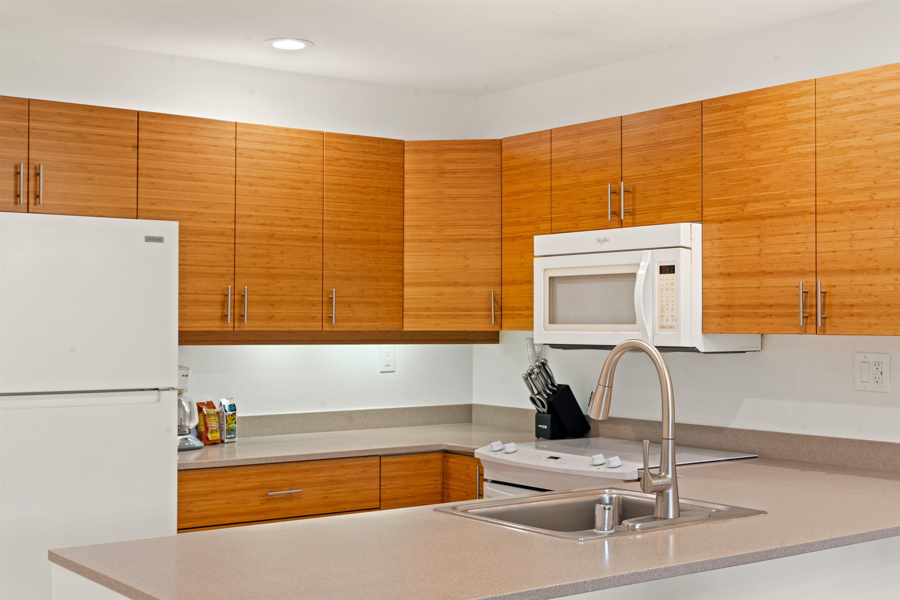 2777 South Kihei Road, Unit K102 Kihei, HI 96753 - Photo 4 of 41 a kitchen with a sink and a refrigerator