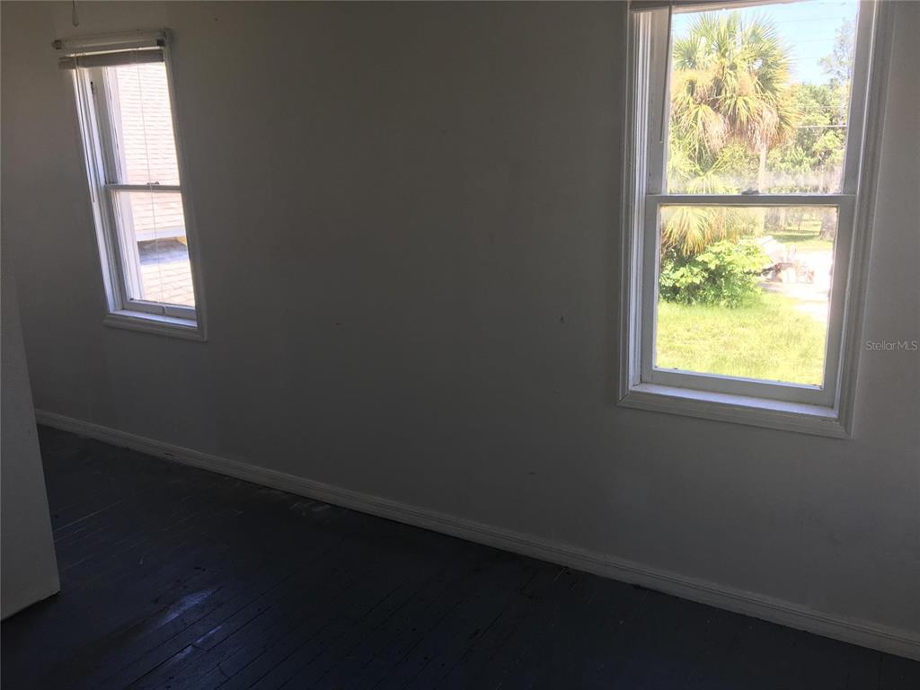 124 Daytona Avenue, Unit 2 Holly Hill, FL 32117 - Photo 6 of 6 an empty room with a window