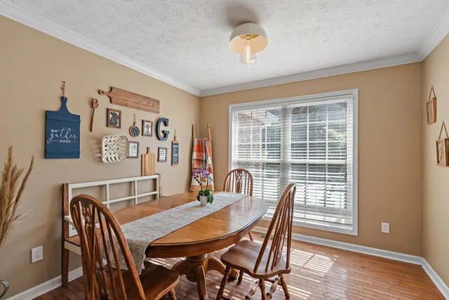 a room with furniture and a wooden floor