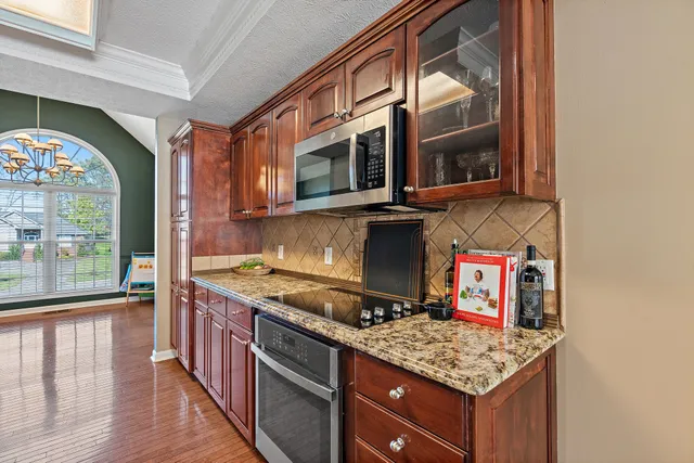 a bedroom with a bed and a flat tv screen