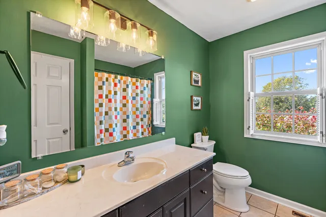 a view of a swimming pool with a patio and a yard