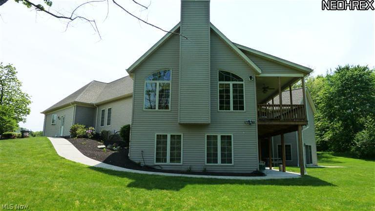 11159 Prouty Road Painesville, OH 44077 - Photo 16 of 21 Rear View of House with Patio and Deck