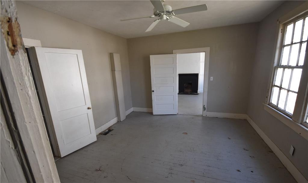 68 Poplar Street Porterdale, GA 30014 - Photo 11 of 13 an empty room with windows and closet