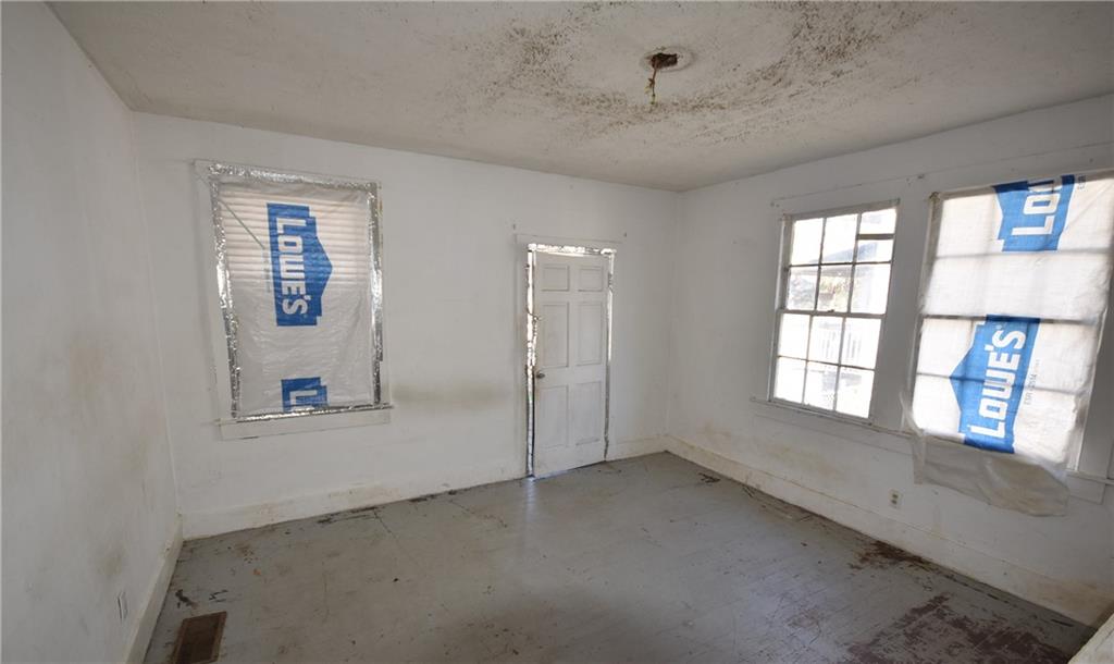 68 Poplar Street Porterdale, GA 30014 - Photo 13 of 13 a view of an empty room with a window