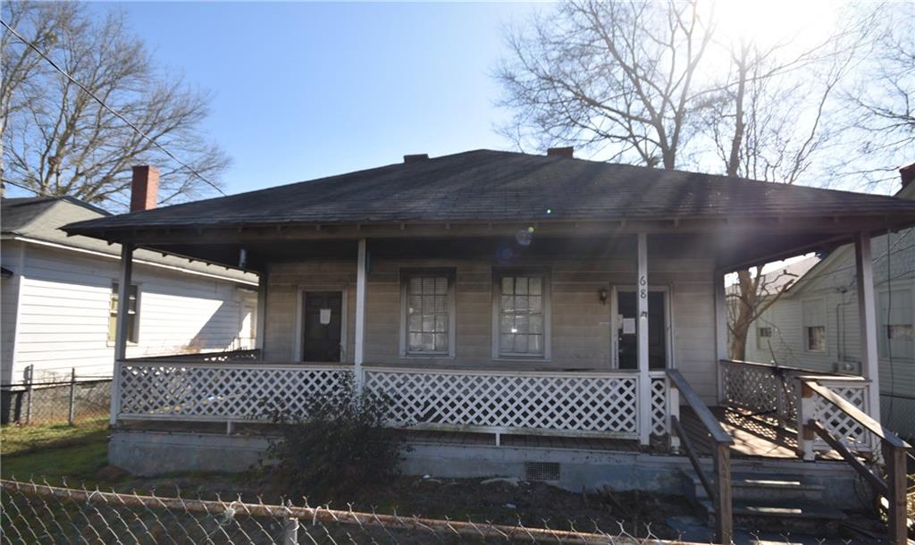 68 Poplar Street Porterdale, GA 30014 - Photo 2 of 13 a view of a house with a large window