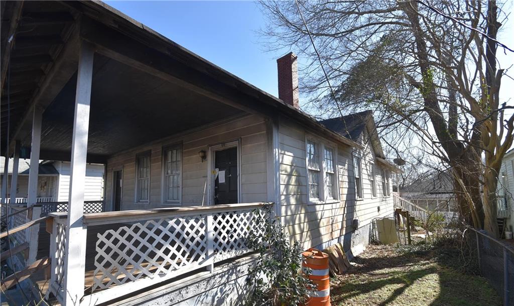 68 Poplar Street Porterdale, GA 30014 - Photo 4 of 13 a view of a house with a large window