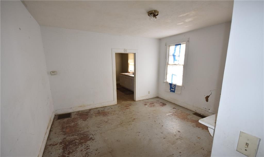 68 Poplar Street Porterdale, GA 30014 - Photo 7 of 13 an empty room with windows