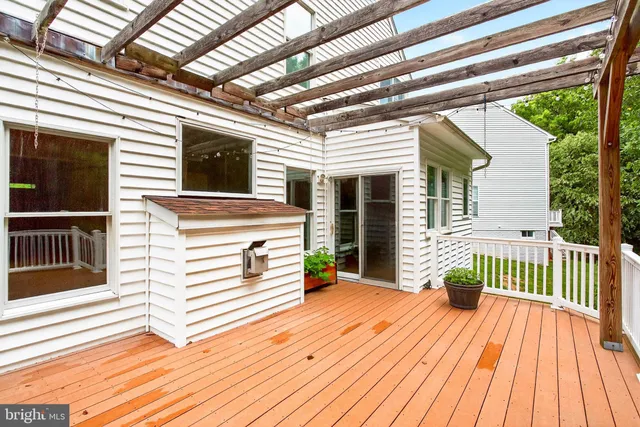 a view of a patio with wooden floor