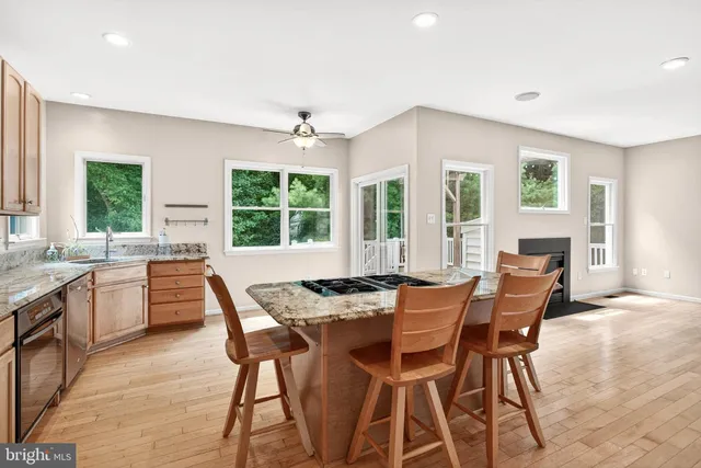 a view of a dining room with furniture and windows